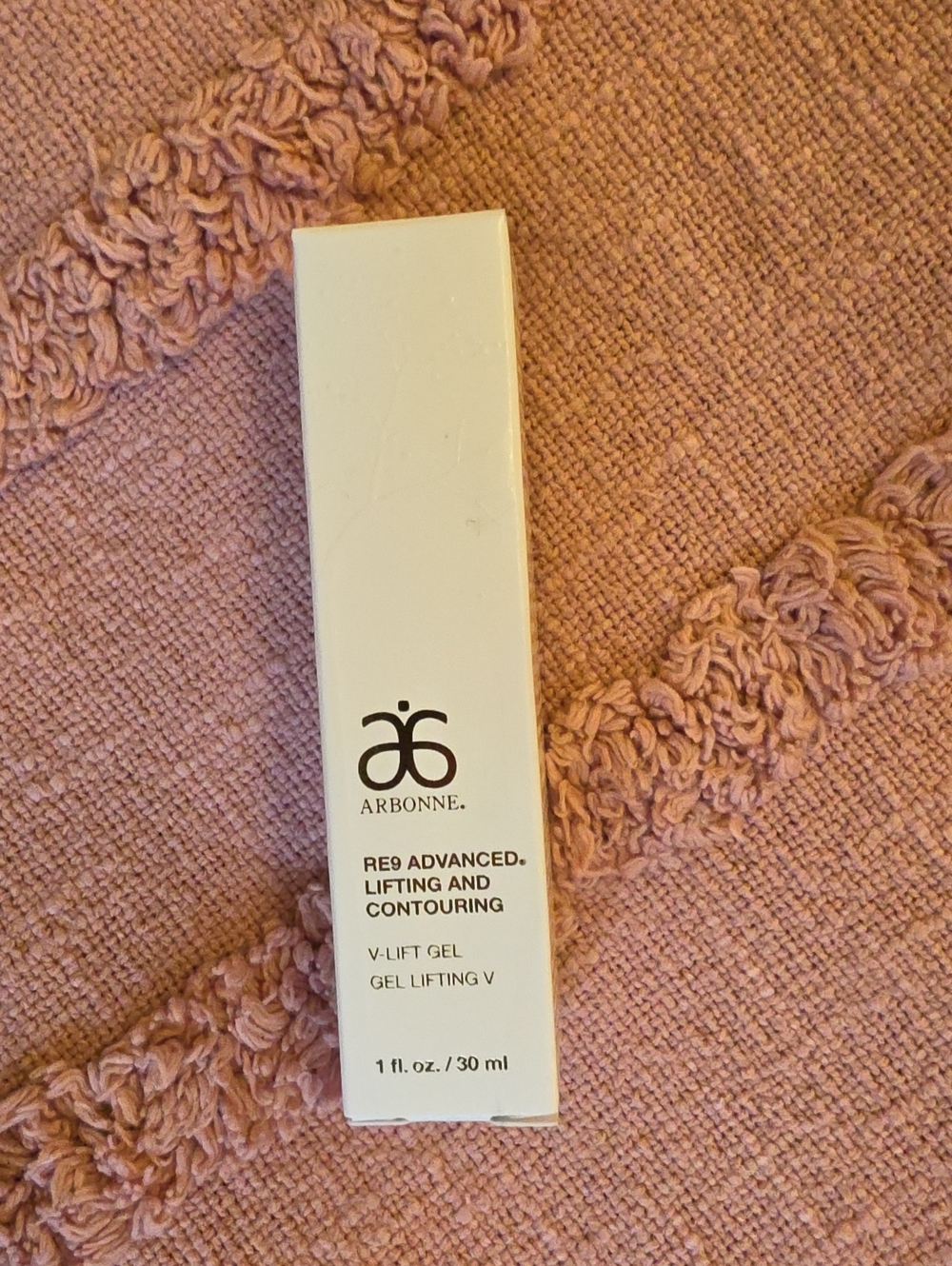 Arbonne RE9 Advanced V-Lift Gel in White on Pink Textile 30ml